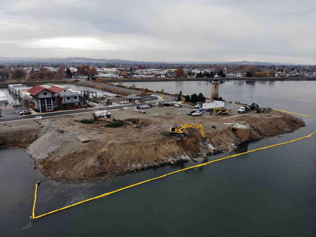 Aerial of excavation work to remove concrete and debris from Clover Island's shoreline.