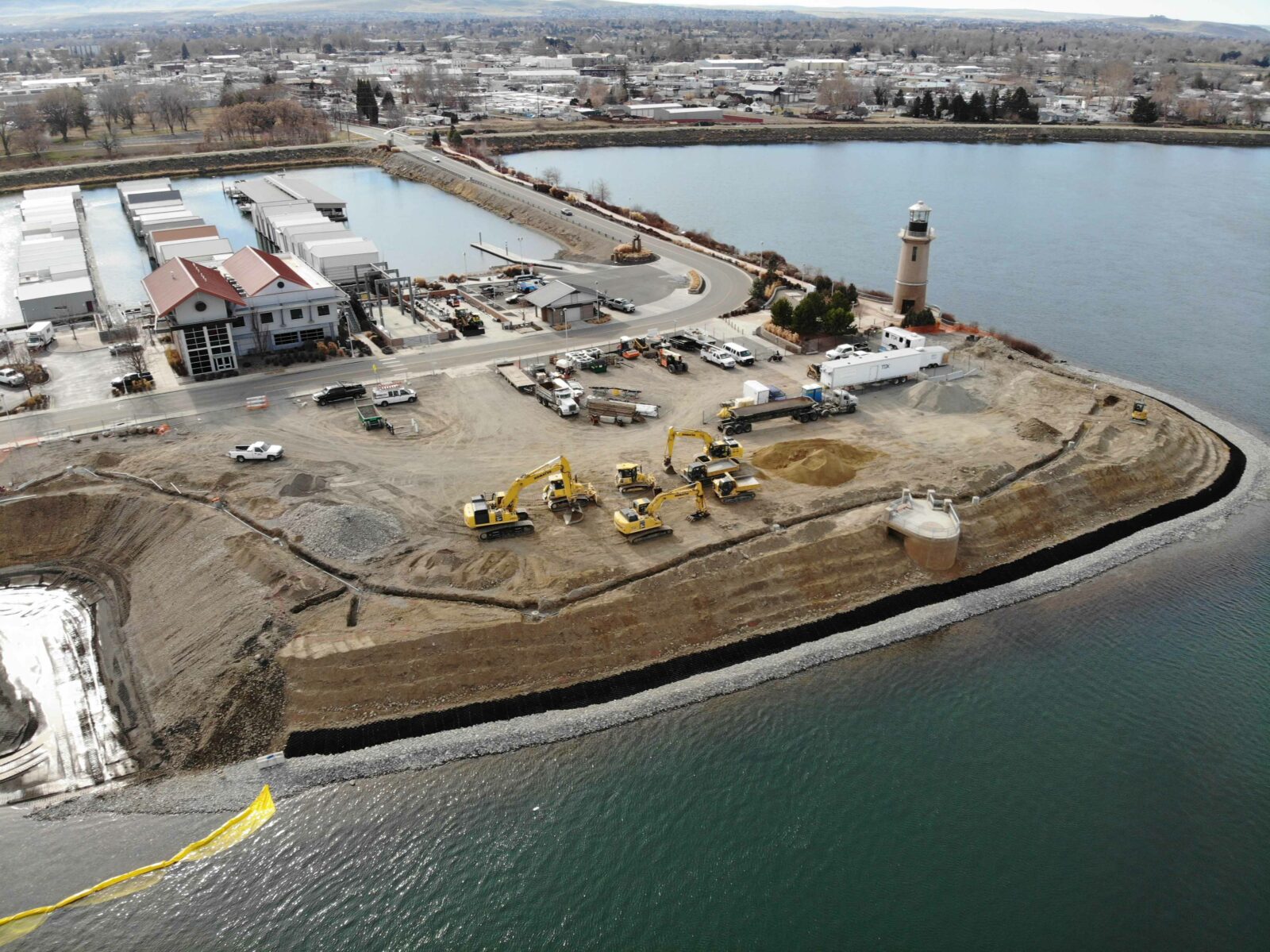 Aerial of crews using heavy equipment to restore the Clover Island shoreline as part of a 2021/2022 project.