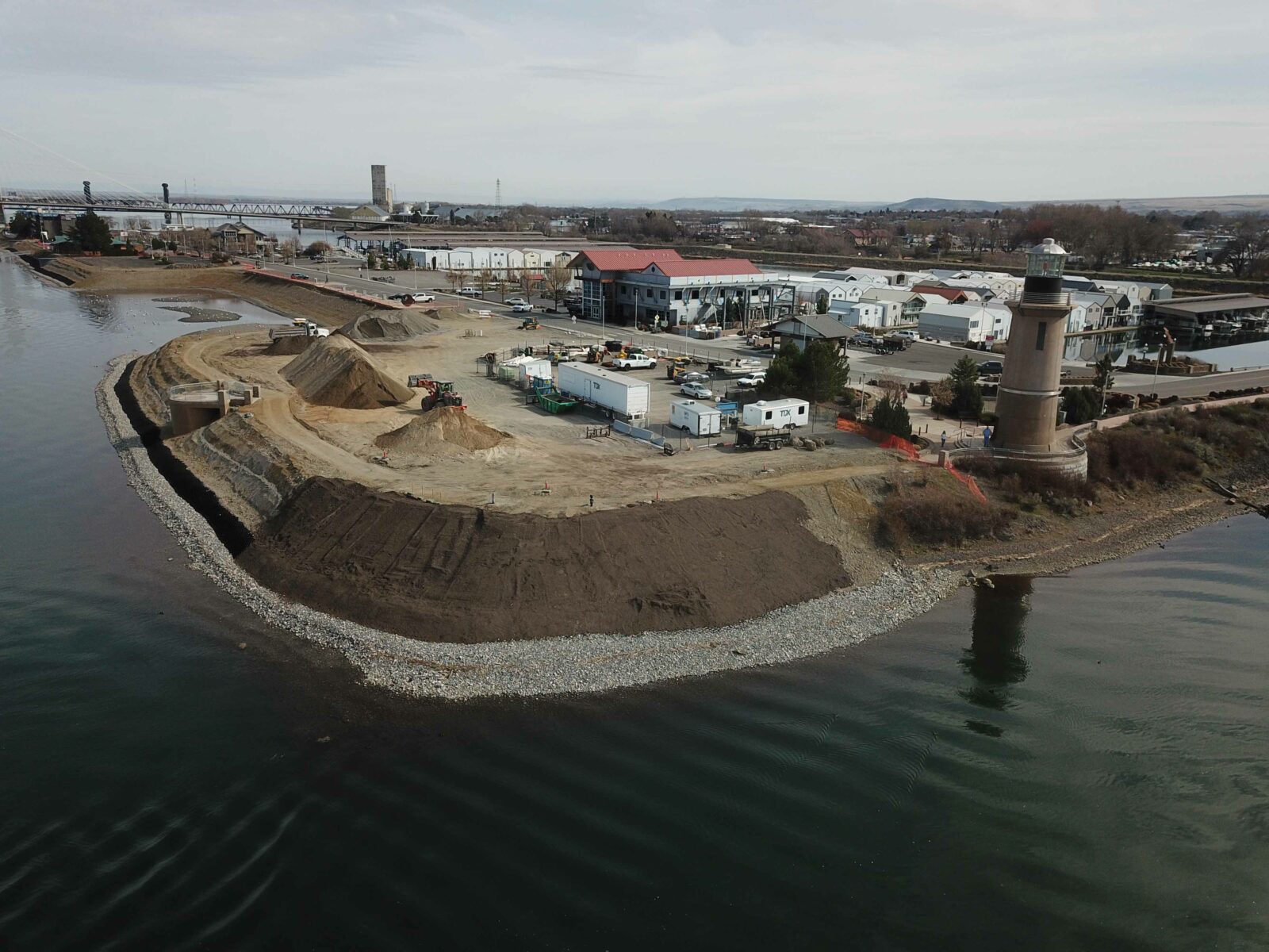 Aerial of crews using heavy equipment to restore the Clover Island shoreline as part of a 2021/2022 project.