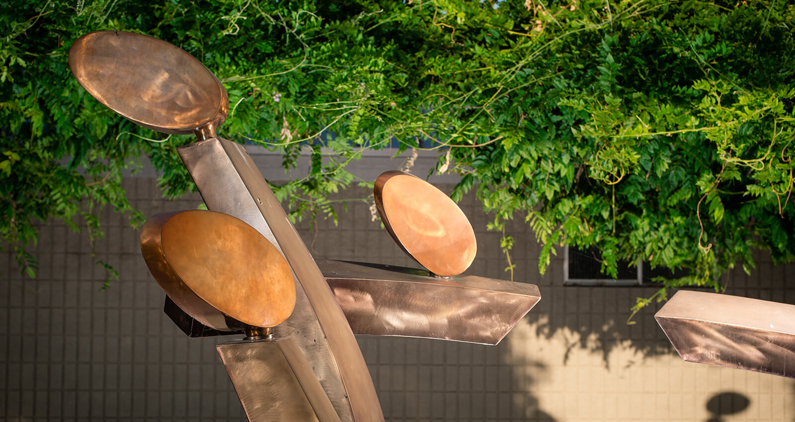 A section of the Family Group artwork's brushed steel and copper structure.