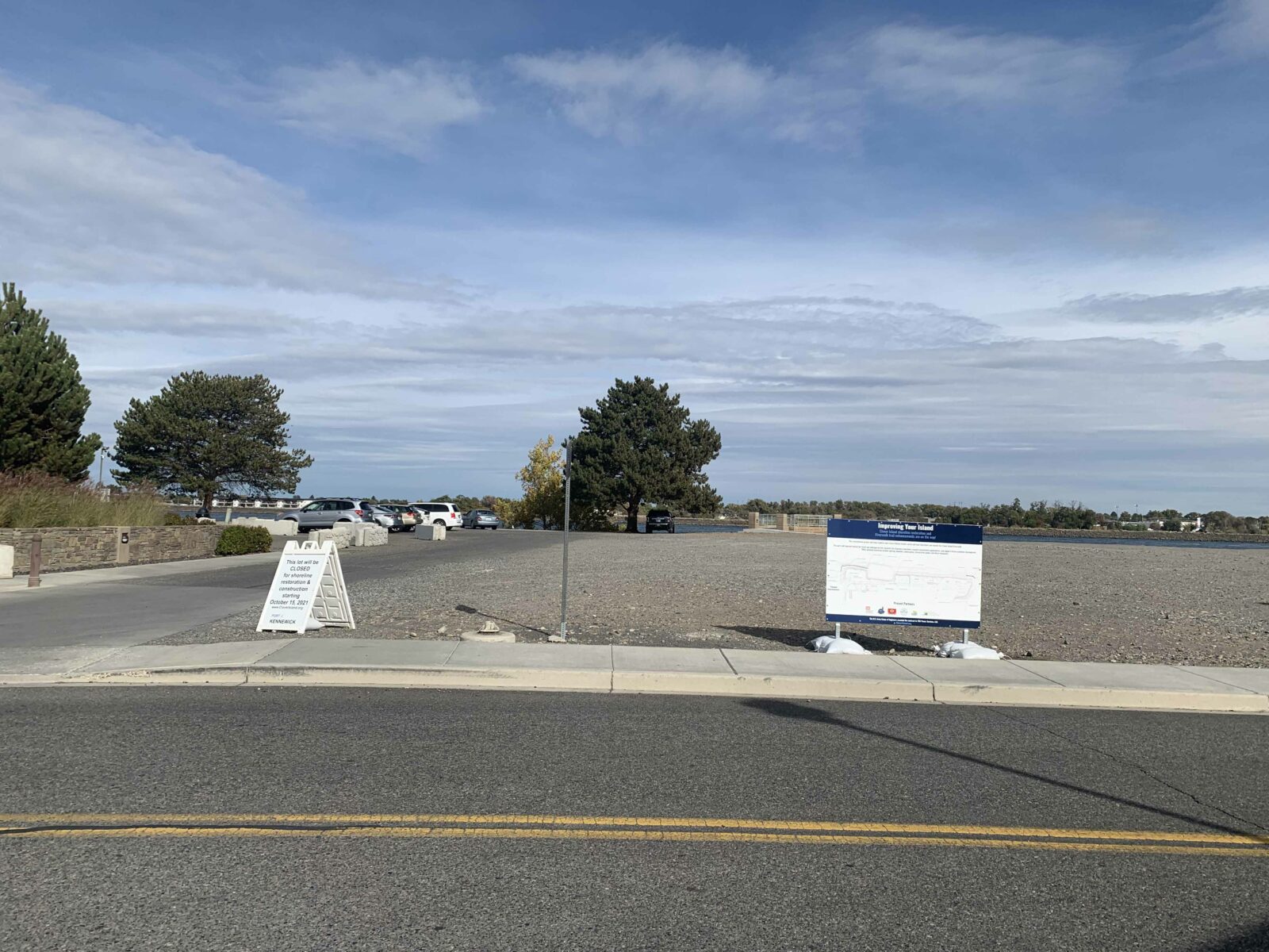 Signage at Clover Island marks a closed parking lot and describes the planned shoreline restoration projects.
