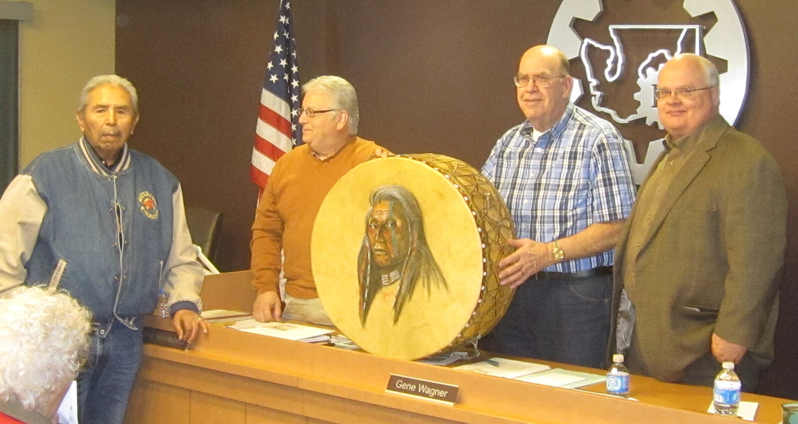 Chief Carl Sampson presents painted drum to Port Commissioners.