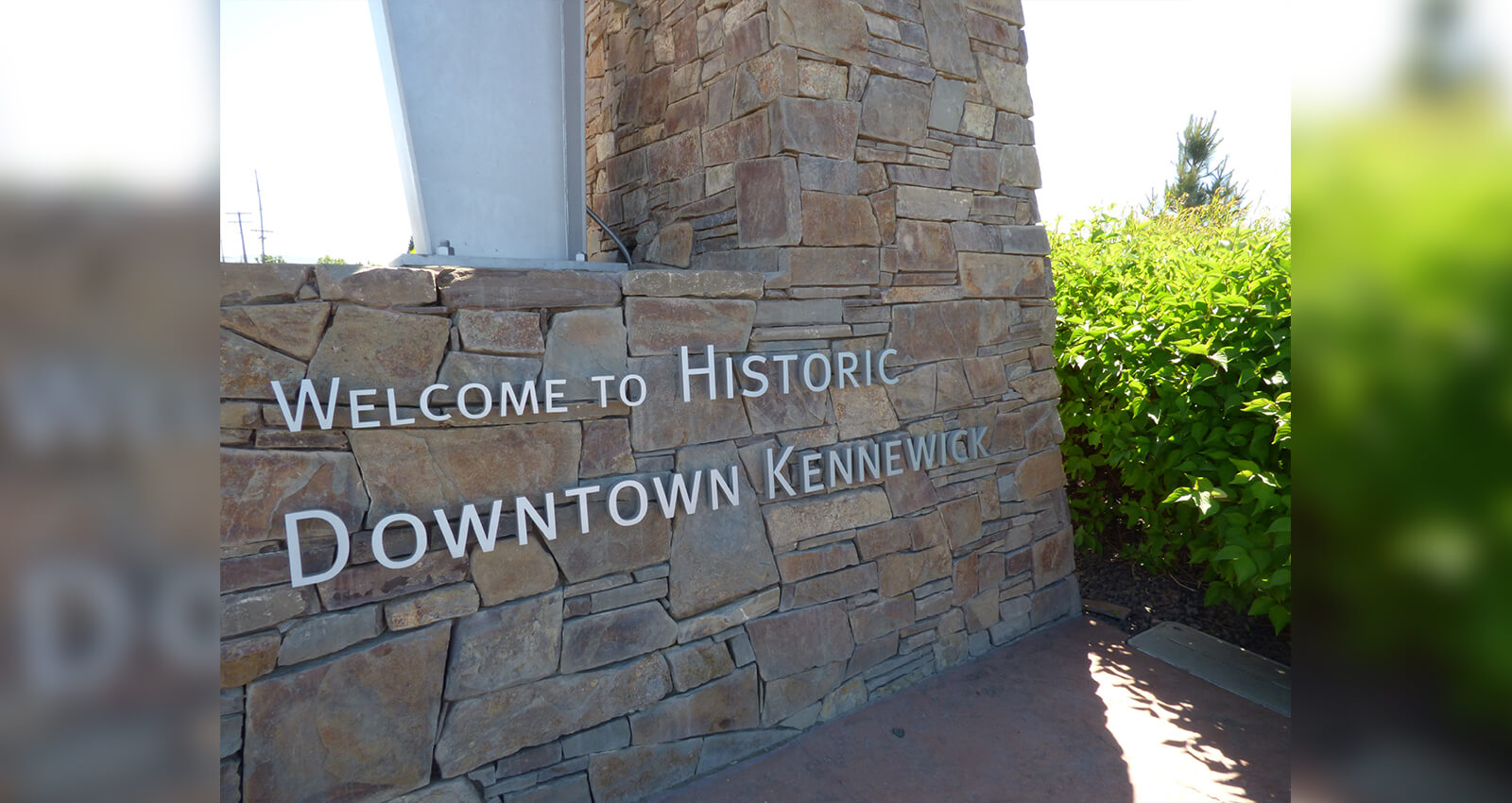 Welcome to Historic Downtown Kennewick sign on island's gateway arch.