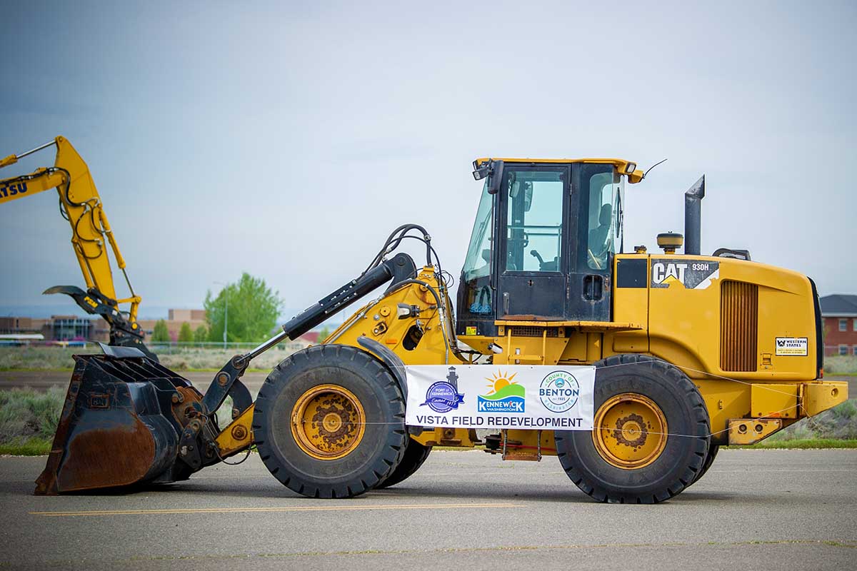 Construction equipment staged on the Vista Field site.