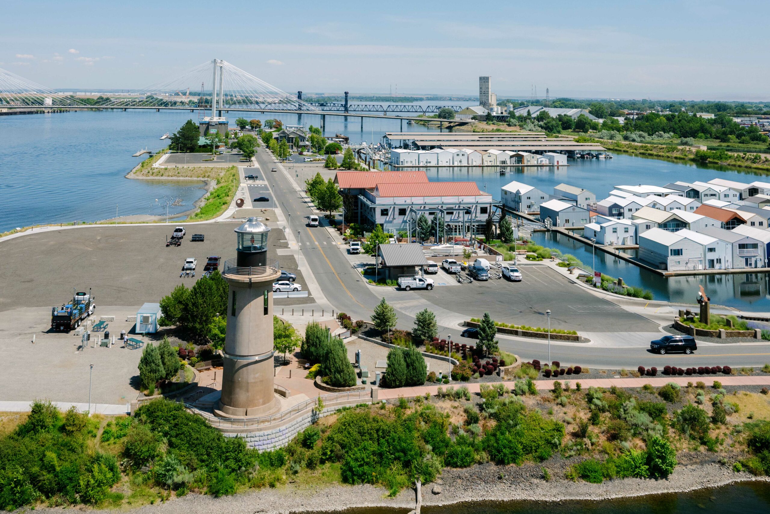 Aerial of Clover Island with the lighthouse and Lighthouse Plaza in the foreground.