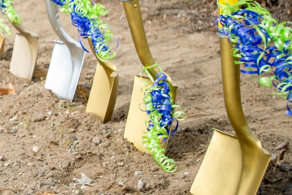 Gold shovels in the dirt and ready for groundbreaking event.